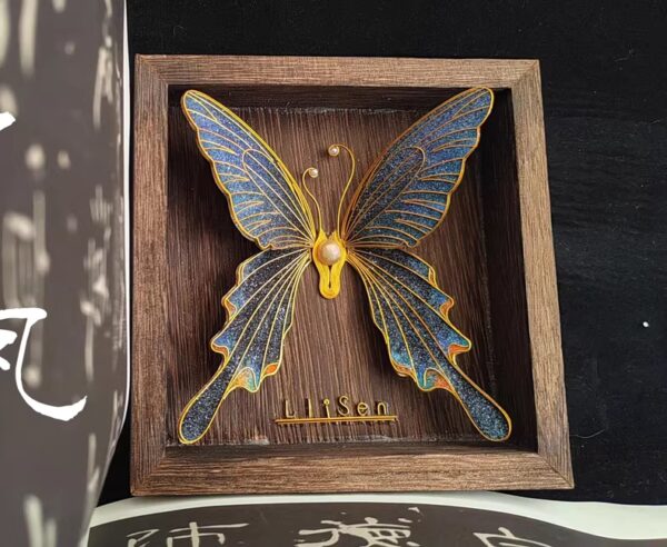 A dark-winged butterfly drifts into motion — layered in shades of night and shimmer.