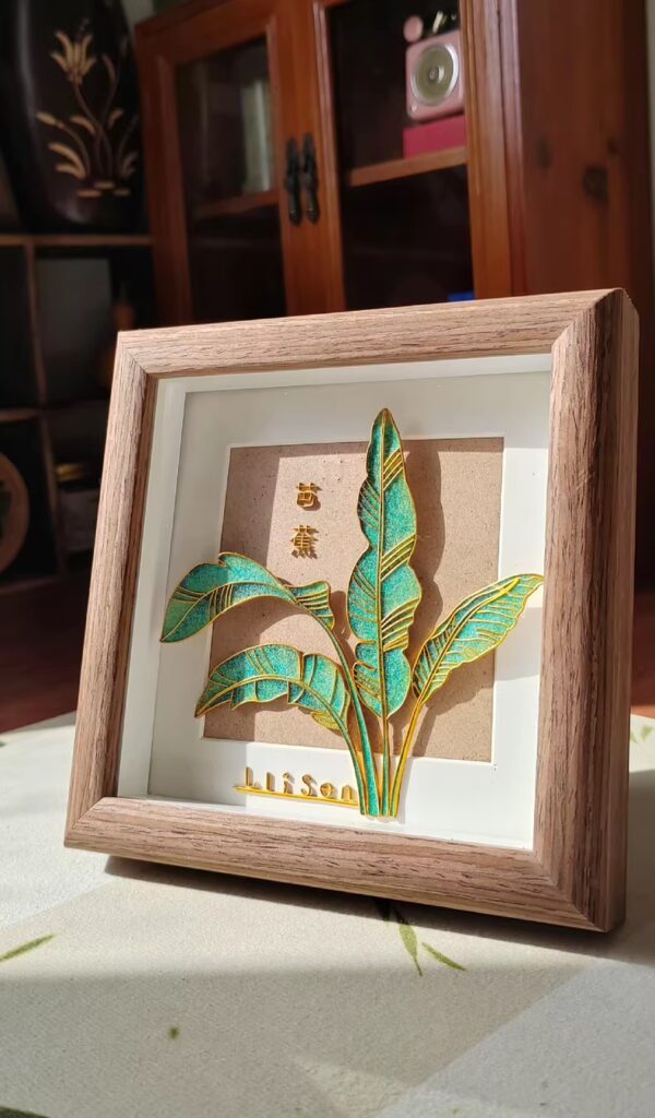 A single tropical leaf captured in wire and enamel — calm, detailed, and refreshingly green.